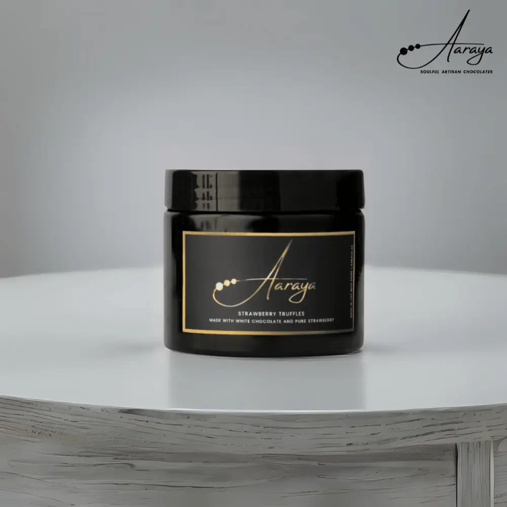 Strawberry Truffle by Aaraya Chocolates: A luxurious blend of real strawberries and velvety white chocolate, handcrafted for a unique sensory experience. Explore the best truffles in Dubai at Aaraya's boutique, a haven for chocolate enthusiasts.