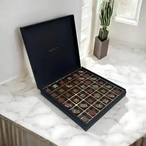 AARAYA® Noir Luxe Festive Luxury Chocolates Box featuring 36 handcrafted premium chocolates in an elegant limited-edition packaging, perfect for Christmas gifting.