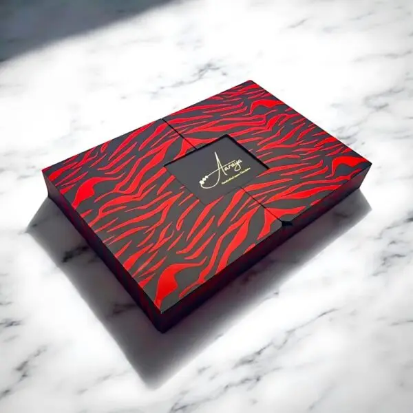 Valentine’s Day Signature Chocolate Love Box by AARAYA® featuring 40 golden heart-shaped chocolates in a luxurious black and red patterned design.
