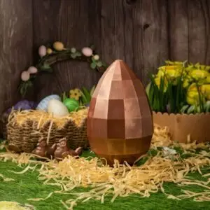 AARAYA® Diamond Luxe Easter Egg 26 CM – a handcrafted luxury chocolate egg with a geometric diamond design and a shimmering bronze finish, made from premium couverture chocolate. Perfect for elegant Easter gifting and festive celebrations