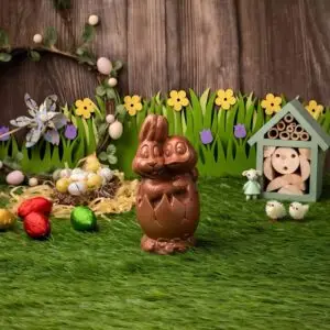 AARAYA® Spring Companions Easter Egg 16 CM – a handcrafted premium chocolate egg accompanied by sculpted bunny and duck figures, made from fine couverture chocolate. A luxurious Easter creation symbolizing joy, friendship, and artisanal elegance.