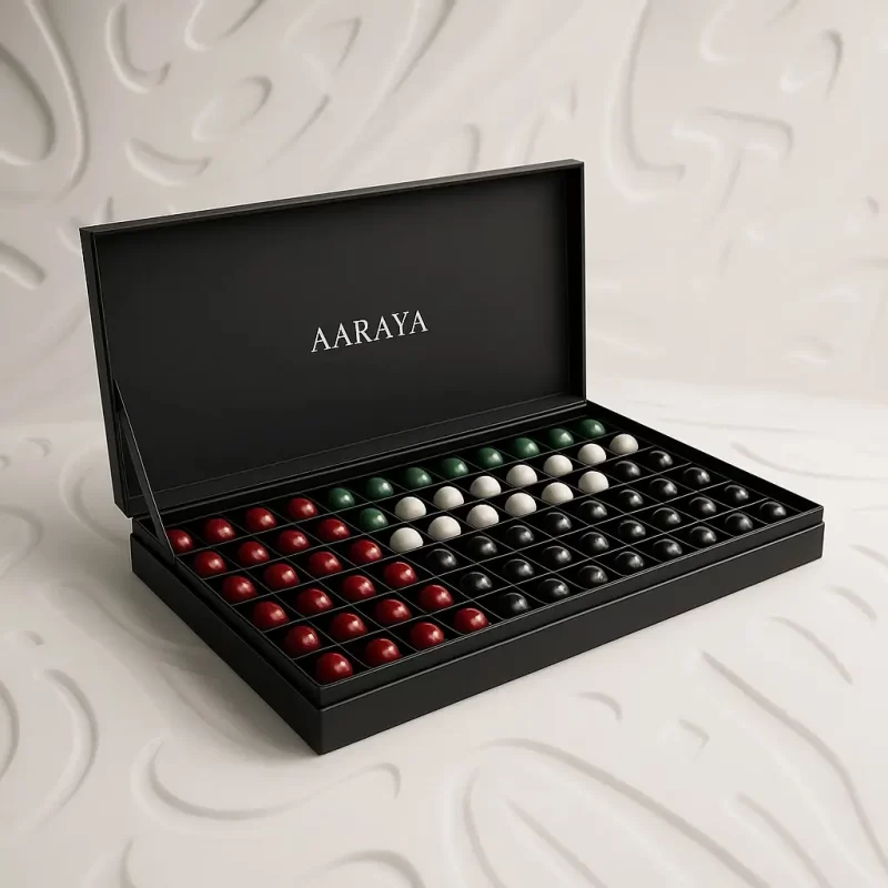 Luxury black AARAYA UAE National Day chocolate box featuring 72 handcrafted chocolates arranged in UAE flag colours