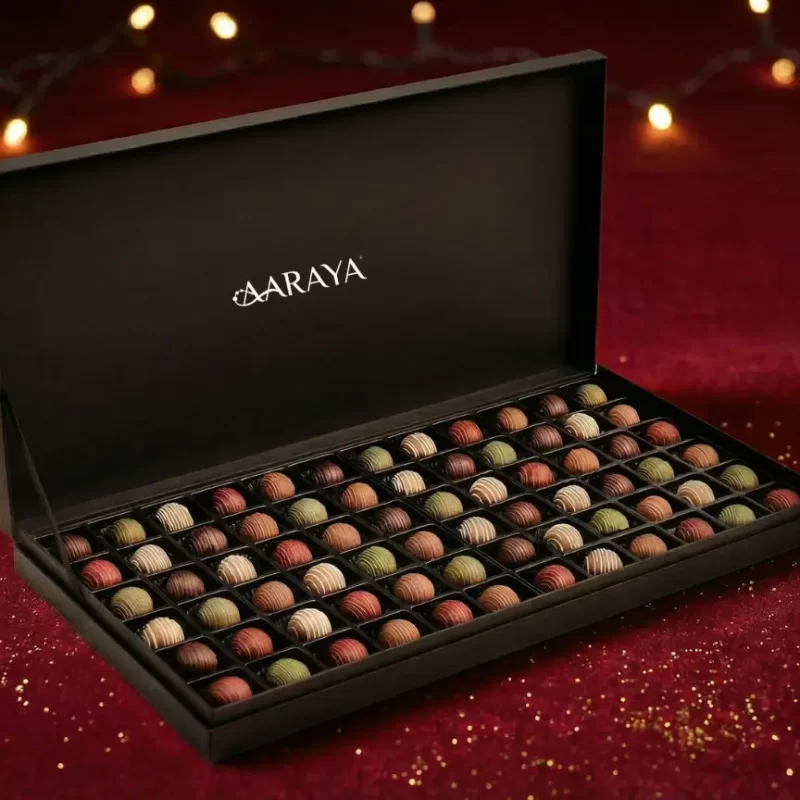 Luxury AARAYA® Christmas Truffle Box - Black Edition featuring 72 handcrafted festive truffles arranged in a premium matte black gift box