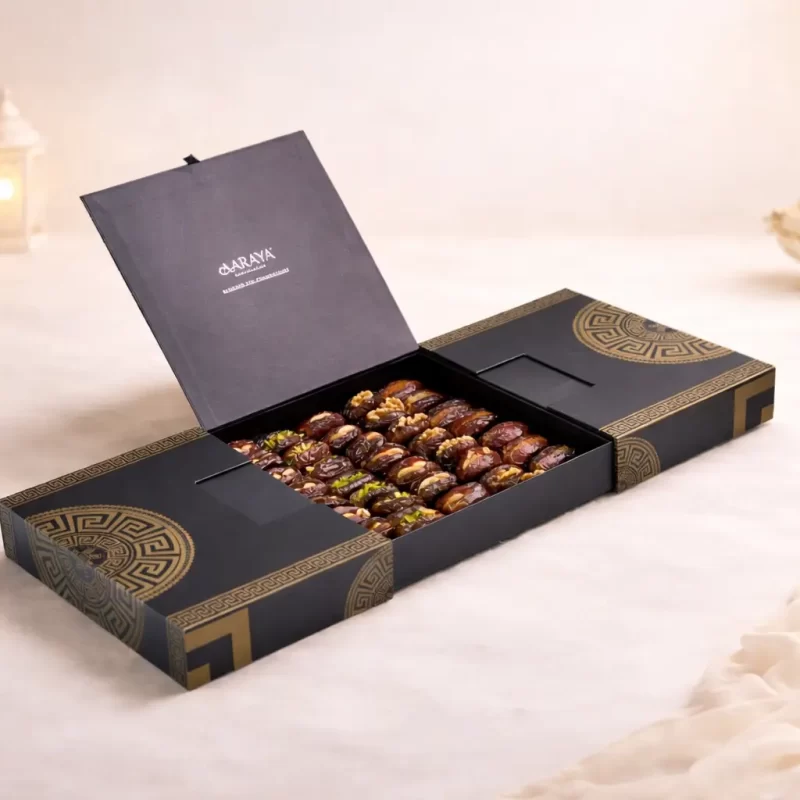 Luxury black and gold Ramadan dates gift box by AARAYA® featuring premium chocolate coated and filled Medjool dates in an elegant 42 x 28 cm presentation.