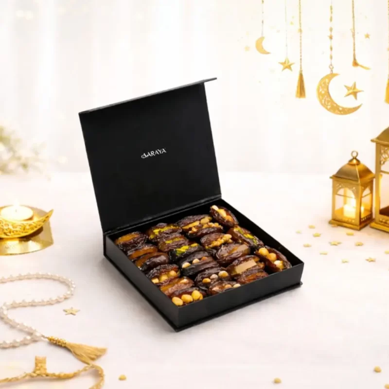 Luxury black Ramadan stuffed dates gift box by AARAYA® featuring premium filled Medjool dates in a small crescent-inspired presentation