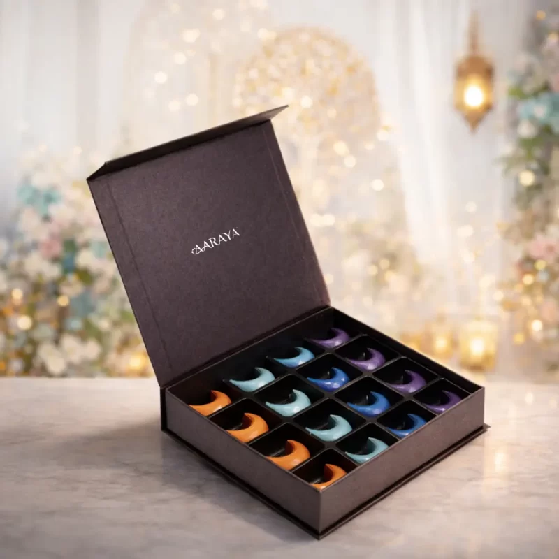 Luxury crescent-shaped Ramadan chocolate gift box by AARAYA® featuring 16 artisan chocolates in celestial-inspired presentation.