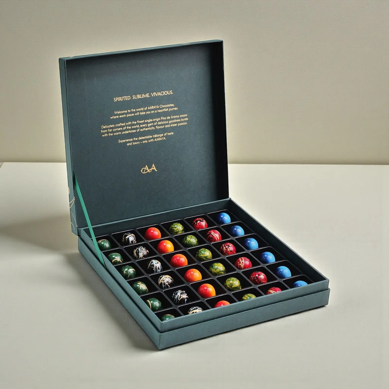 Premium green Christmas chocolate gift box by AARAYA® showcasing 36 handcrafted festive praline chocolates.